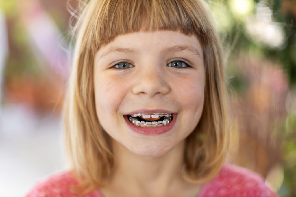 Portrait of smiling little girl with braces